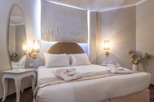 Ένα ή περισσότερα κρεβάτια σε δωμάτιο στο Agripas Boutique Hotel