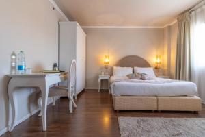 Ένα ή περισσότερα κρεβάτια σε δωμάτιο στο Agripas Boutique Hotel