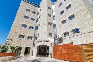 a large brick building with a large entrance at Agripas Boutique Hotel in Jerusalem