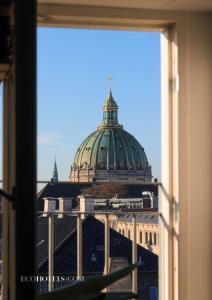 a view of the dome of a building from a window at Babette Guldsmeden in Copenhagen