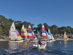 a group of sailboats on a body of water at La ti case - studio de charme au coeur du medoc in Saint-Laurent-de-Médoc