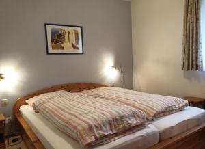 Postel nebo postele na pokoji v ubytování Karlshagen, Ferienhaus Ostseebrise