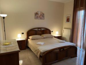 Postel nebo postele na pokoji v ubytování [Apulian Heart] Elegante Appartamento