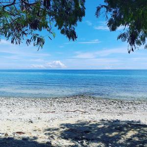 a view of the ocean from the beach at Azulea Lodging House Oslob in Oslob