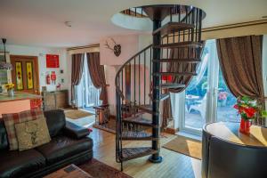 a spiral spiral staircase in a living room at Lincoln Holiday Retreat View with Private Hot Tub in Lincoln