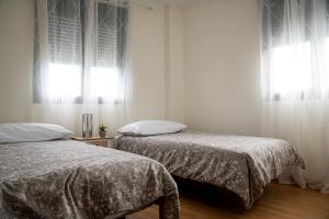 Postel nebo postele na pokoji v ubytování Apartamento El Tajaraste