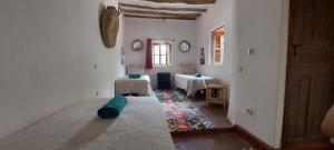 a room with two tables and a bed in it at Les Jardins de Taja in Ourika +121 photos