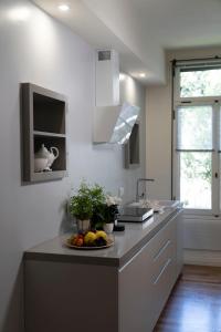 a kitchen with a counter with a plate of fruit on it at Mocenigo Grand Canal Luxury Suites in Venice