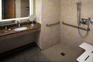 a bathroom with a sink and a shower at Hyatt Regency Jacksonville Riverfront in Jacksonville