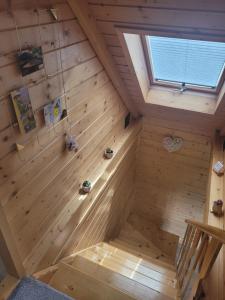 an inside view of a wooden sauna with a window at Slope House (Domek na Skarpie) Lipowa in Lipowa