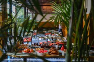 a buffet line with a lot of food on display at Bazzar Boutique Hotel in Tbilisi City