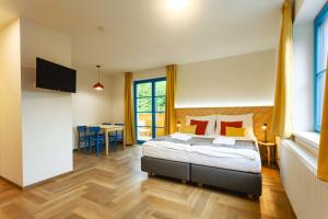 Postel nebo postele na pokoji v ubytování Hotel Edvard