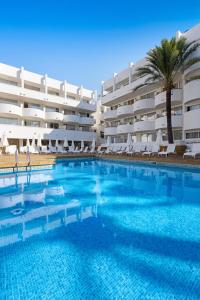 a large swimming pool in front of a hotel at Palmanova Beach Apartments by TRH in Palmanova