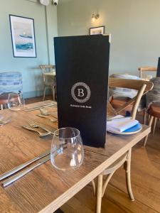 a black box sitting on top of a wooden table at Balcomie Links Hotel in Anstruther