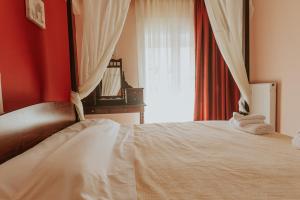 Łóżko lub łóżka w pokoju w obiekcie MARIAM APARTMENT