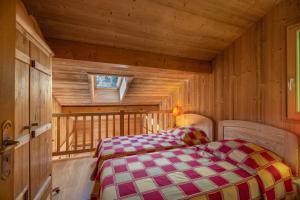 Katil atau katil-katil dalam bilik di Très beau chalet vue Mont-blanc