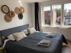Ένα ή περισσότερα κρεβάτια σε δωμάτιο στο Short Stay Zandvoort