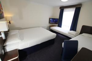 Postel nebo postele na pokoji v ubytování Ramada Oxford
