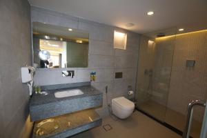 a bathroom with a sink and a toilet and a shower at Petra Sella Hotel in Wadi Musa +37 photos