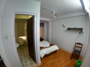 Postel nebo postele na pokoji v ubytování Om Tara Guest House Pvt Ltd