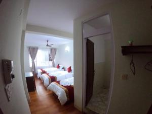 Postel nebo postele na pokoji v ubytování Om Tara Guest House Pvt Ltd