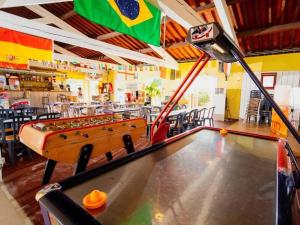a pool table in a restaurant with a flag at Camping Le Roussillon - Maeva in Saint-Cyprien