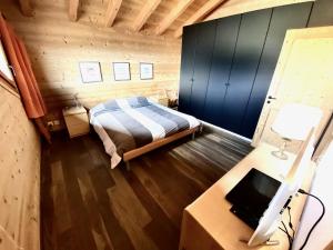 Rúm í herbergi á Chalet Les Dalton, Morgins