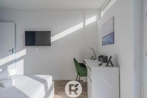 Televízia a/alebo spoločenská miestnosť v ubytovaní R'Apparts T2 Le Belledonne View
