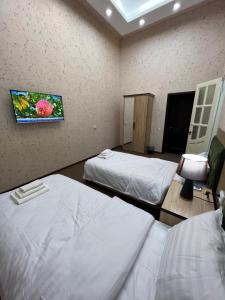 Postel nebo postele na pokoji v ubytování HOTEL DaMir