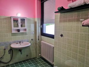 a bathroom with a sink and a mirror at B&B VILLA DIEGO in Sondrio