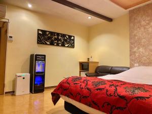 Postel nebo postele na pokoji v ubytování ホテル艶グループ　富津店