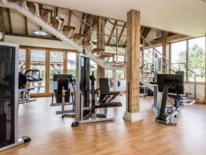 a gym with treadmills and cardio equipment in a building at Silver Birches in Wisbech