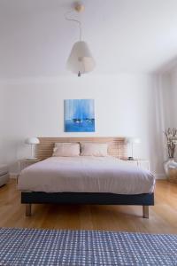 Posteľ alebo postele v izbe v ubytovaní Bel appartement bourgeois au centre-ville de Biarritz