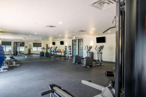a gym with treadmills and cardio equipment in a building at 2BR Executive Suite With Pool, Gym and Fast Wi-Fi By ENVITAE in Dallas