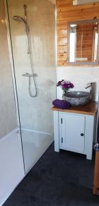 a bathroom with a tub and a sink and a shower at Secret Cloud House Holidays Luxury Yurts with Hot Tubs in Cauldon