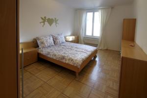 a small bedroom with a bed and a window at Top Location Vienna Marc Aurel in Vienna