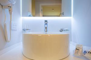 Um banheiro em Cilene del Fuego Suites & Spa