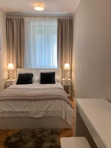 Posteľ alebo postele v izbe v ubytovaní Apartment BB II nad Deptakiem