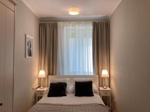 Posteľ alebo postele v izbe v ubytovaní Apartment BB II nad Deptakiem