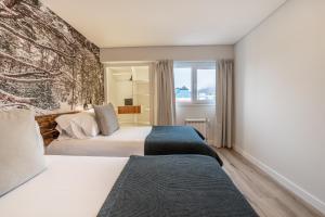 Cama ou camas em um quarto em Cilene del Fuego Suites & Spa