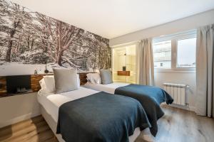 Cama ou camas em um quarto em Cilene del Fuego Suites & Spa