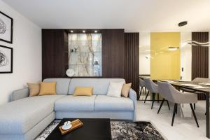 a living room with a couch and a dining room at Diamond Beach Sarafovo by KP - Luxury Collection, Apt 5 in Burgas