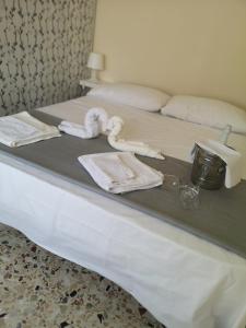 Un pat sau paturi într-o cameră la Casa Giordalisia