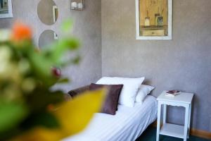 Postel nebo postele na pokoji v ubytování Hôtel Picardia