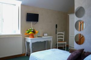 TV a/nebo společenská místnost v ubytování Hôtel Picardia