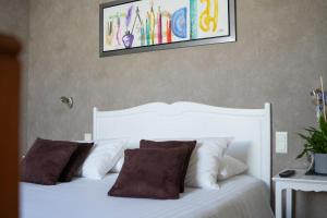 Postel nebo postele na pokoji v ubytování Hôtel Picardia
