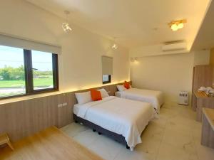 Postel nebo postele na pokoji v ubytování FUN Style Homestay