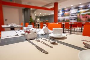 Um restaurante ou outro lugar para comer em Cilene del Fuego Suites & Spa