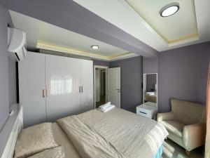 A bed or beds in a room at X SUITE APART