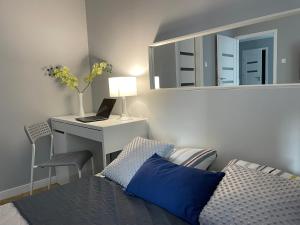 Posteľ alebo postele v izbe v ubytovaní Apartament AMSTERDAM